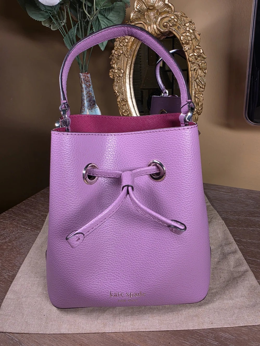 kate spade New York Eva Lavender Mauve Pebbled Leather Bucket Crossbody ($329)